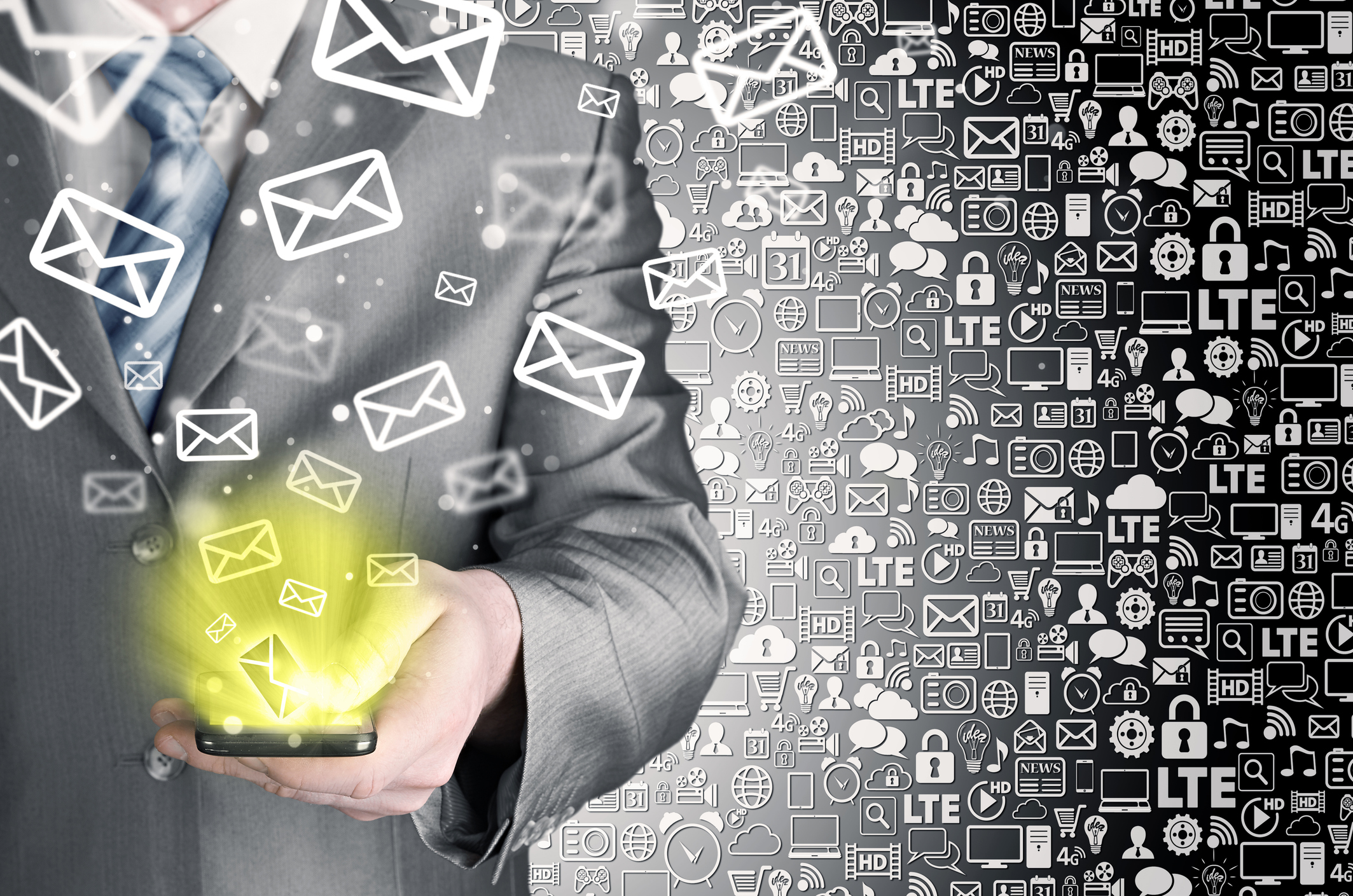Business man holding smart phone and sending emails